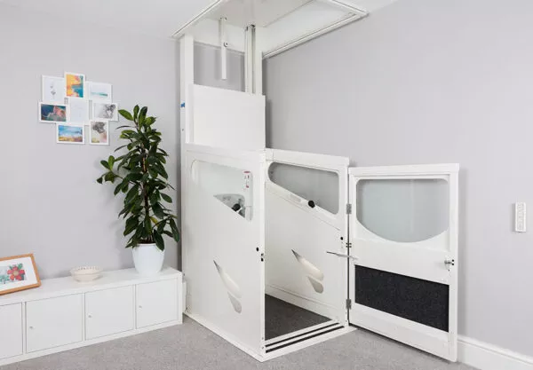 Through-floor lift travelling between two floors
