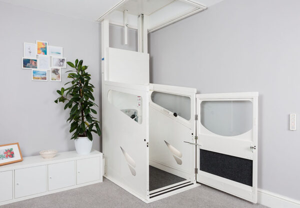 Through-floor lift travelling between two floors