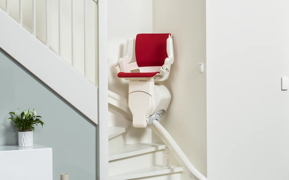 single-rail Image shows a curved stairlift with a single rail