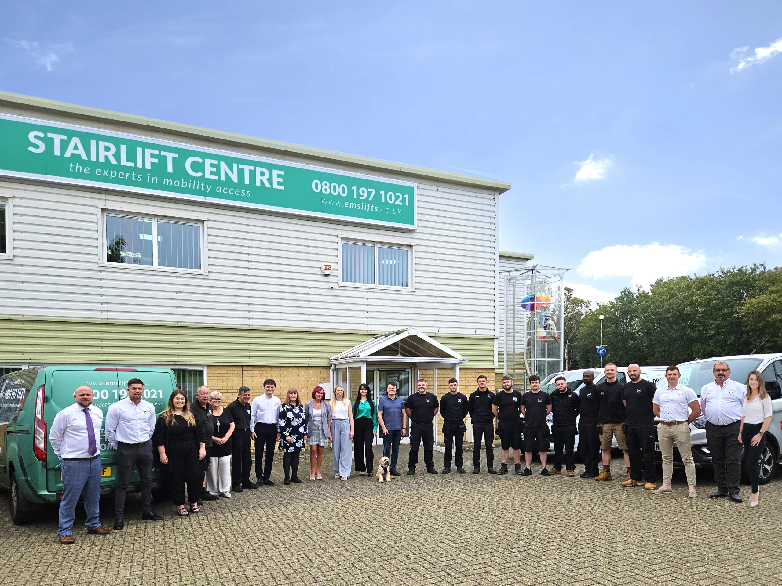 home-page-image-bright-scaled Image shows EMS employees outside EMS House Stairlift Centre